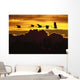 Alaska, Sandhill Crane Flying Above Clouds In Golden Sunset Sky Wall Mural