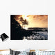 Rocky Shoreline With Palms Silhouetted At Sunset Wall Mural