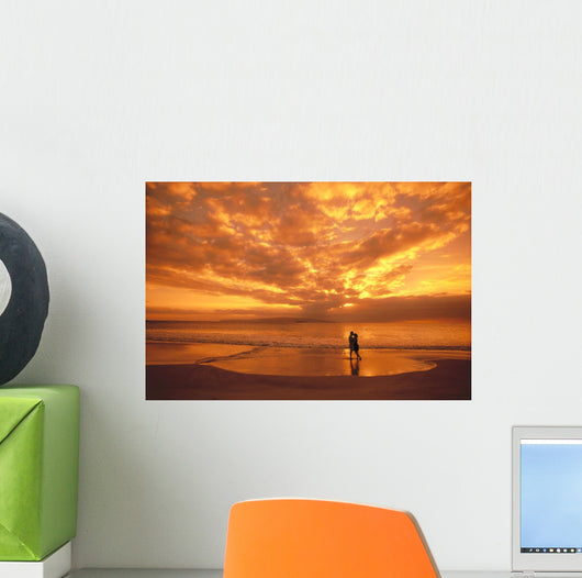 Couple Silhouetted On The Beach During Sunset Wall Mural