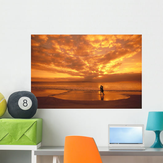 Couple Silhouetted On The Beach During Sunset Wall Mural