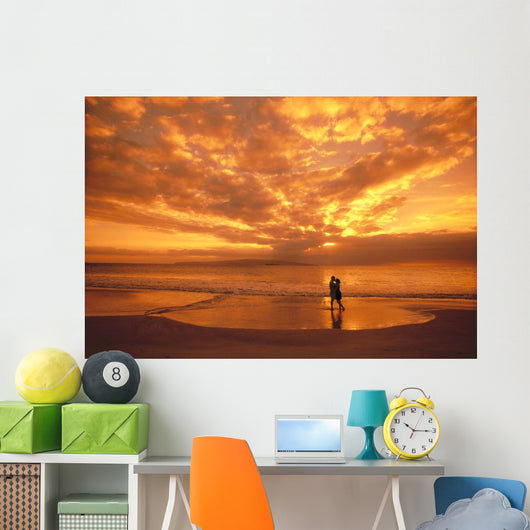 Couple Silhouetted On The Beach During Sunset Wall Mural