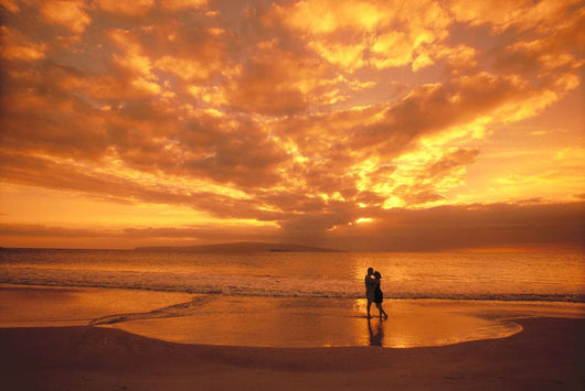 Couple Silhouetted On The Beach During Sunset Wall Mural