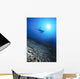 Silhouetted By Sunburst In Blue Ocean Wall Mural