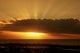 Sun Behind Cloud Sending Sunrays Into The Sky Wall Mural