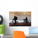 two bikers on beach and sunset Wall Mural