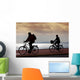 two bikers on beach and sunset Wall Mural