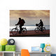 two bikers on beach and sunset Wall Mural