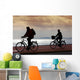 two bikers on beach and sunset Wall Mural