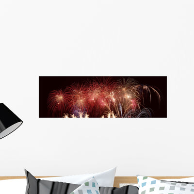Panoramic Fireworks Night Sky Wall Mural shown on a wall