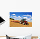 Tractor in plowed field Wall Mural