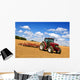 Tractor in plowed field Wall Mural