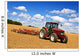Tractor in plowed field Wall Mural