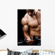 Powerful muscular man lifting weights Wall Mural
