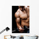 Powerful muscular man lifting weights Wall Mural