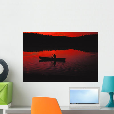 Canoeing Sunset Algonquin Park Wall Mural shown on a wall