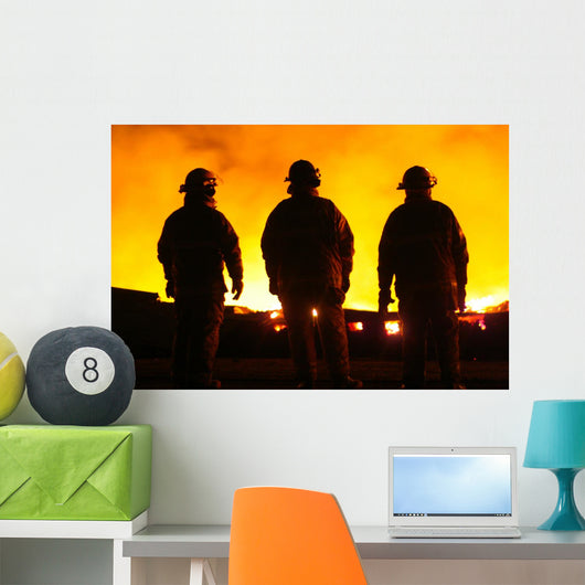A silhouette of three fire fighters Wall Mural