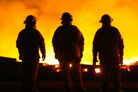 A silhouette of three fire fighters Wall Mural