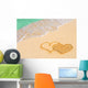 Drawing connected hearts on beach Wall Mural