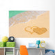 Drawing connected hearts on beach Wall Mural