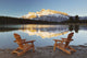 Muskoka Chairs In Front Of Mt Rundle And Two Jack Lake Wall Mural