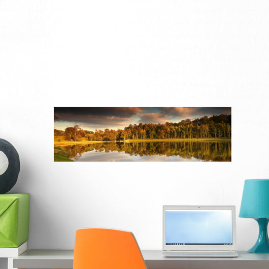 Trees Lining The Water's Edge Reflected In The Water In Autumn Wall Mural