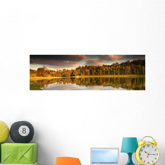 Trees Lining The Water's Edge Reflected In The Water In Autumn Wall Mural