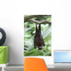 A Flying Fox Bat Hangs Upside Down From A Tree Branch Wall Mural