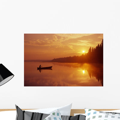 Canoeing Child's Lake Sunrise Wall Mural shown on a wall