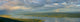Panoramic Of An Approaching Storm And With A Rainbow Wall Mural