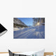 Sunlight Breaking Through Trees On Snow-Covered Medicine Lake Wall Mural