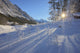 Sunlight Breaking Through Trees On Snow-Covered Medicine Lake Wall Mural