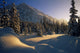 Sun Setting Behind Trees And Mountain Wall Mural