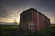An Abandoned Railway Boxcar Converted To A Storage Shed At Sunset Wall Mural