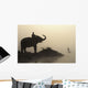 An Elephant With Its Mahout Stand At The Edge Of The Rapti River Wall Mural