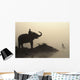 An Elephant With Its Mahout Stand At The Edge Of The Rapti River Wall Mural