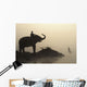 An Elephant With Its Mahout Stand At The Edge Of The Rapti River Wall Mural