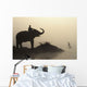 An Elephant With Its Mahout Stand At The Edge Of The Rapti River Wall Mural