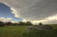 Storm Clouds Gather Over An Abandoned Farm Stead, Rural Saskatchewan Wall Mural