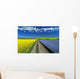 Road Through Flowering Flax And Canola Fields Wall Mural