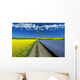 Road Through Flowering Flax And Canola Fields Wall Mural