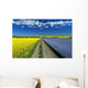 Road Through Flowering Flax And Canola Fields Wall Mural