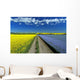 Road Through Flowering Flax And Canola Fields Wall Mural
