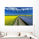 Road Through Flowering Flax And Canola Fields Wall Mural