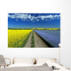 Road Through Flowering Flax And Canola Fields Wall Mural