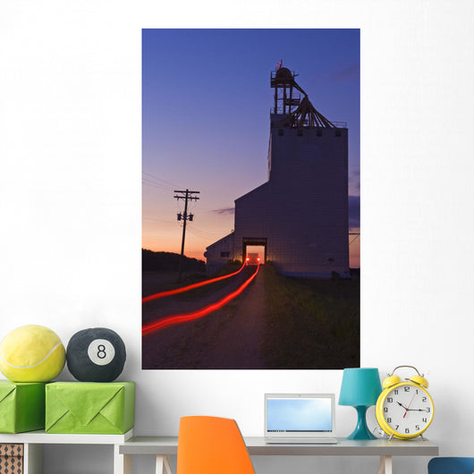 Streak Of Truck Lights And An Old Grain Elevator, Virden, Manitoba Wall Mural