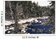 Ouareau River And Snow Covered Evergreen Trees In Winter Wall Mural