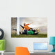 Shoot of football player and jump of goalkeeper on the field of Wall Mural