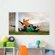 Shoot of football player and jump of goalkeeper on the field of Wall Mural