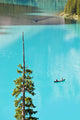 Canoeing On Turquoise Water Of Moraine Lake Wall Mural