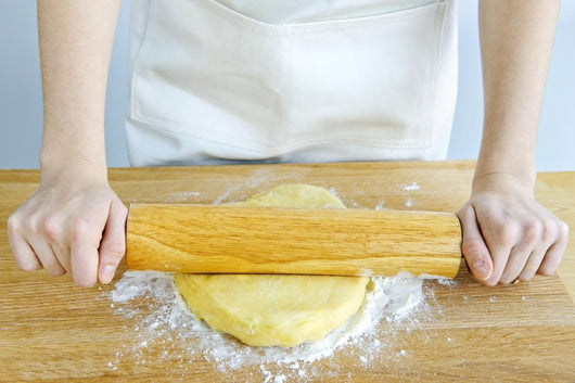 Hands with rolling pin and cookie dough Wall Mural